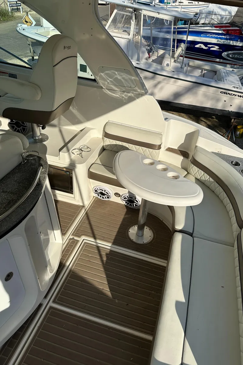 Slide: The Image of 2007 Cruisers 390 Sport Coupe interior with white seating and wooden flooring. - 11