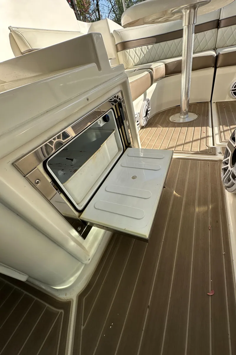 Slide: The Image of 2007 Cruisers 390 Sport Coupe interior with open storage compartment and seating area. - 14