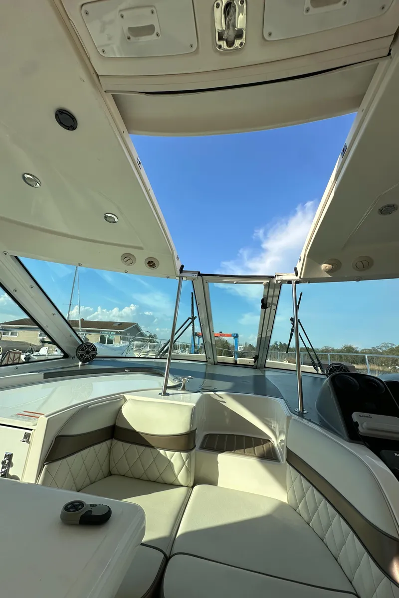 Slide: The Image of 2007 Cruisers 390 Sport Coupe interior with open sunroof and luxurious seating. - 18