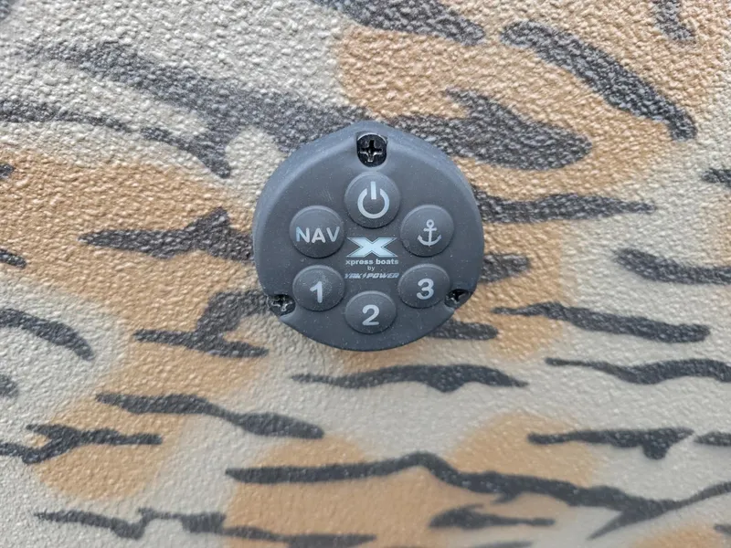 Slide: The Image of Control panel on camo-patterned Xpress HD16DB duck hunting boat, 2026 model. - 5