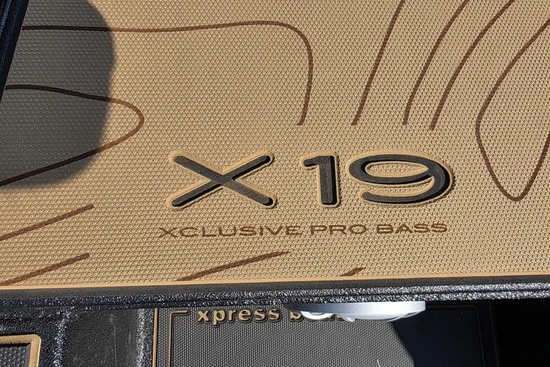 Slide: The Image of 2026 Xpress X19 Pro Bass boat floor with embossed logo design. - 14
