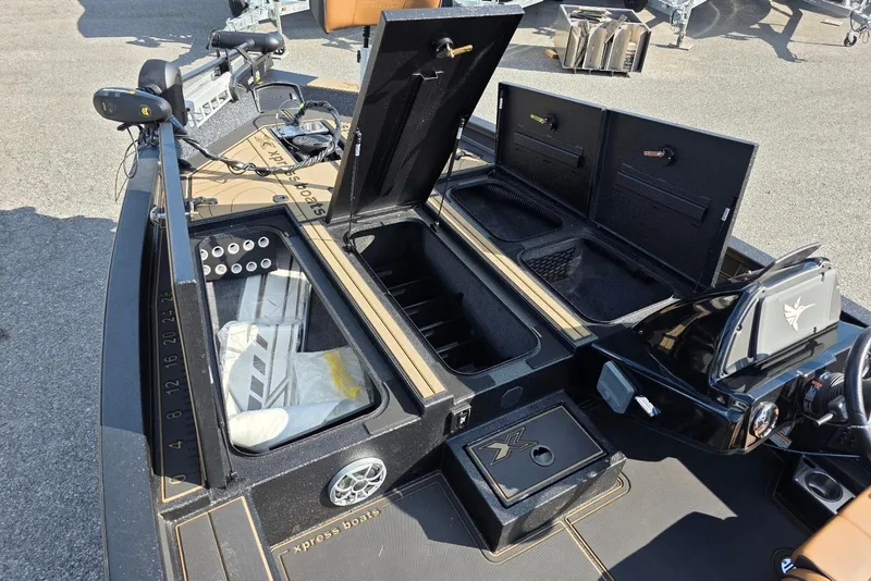 Slide: The Image of 2026 Xpress X19 Pro Bass boat interior with Yamaha Vmax 200 SHO engine, storage compartments open. - 16