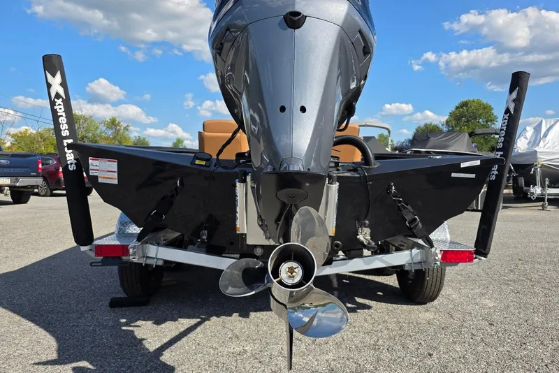 Slide: The Image of 2026 Xpress X19 Pro Bass boat with Yamaha Vmax 200 SHO engine, rear view. - 19