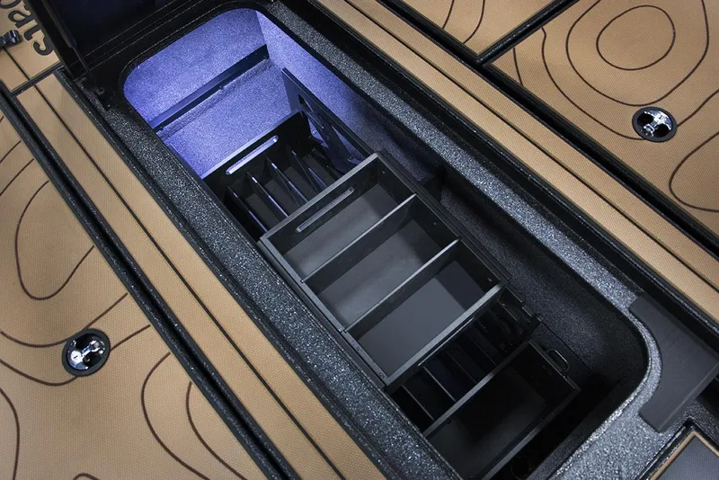 Slide: The Image of Open storage compartment in Xpress X19 Pro Bass boat, showcasing organized interior layout. - 3