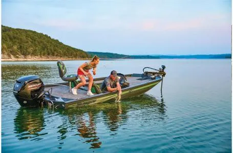 Slide: The Image of 2025 Ranger RT178 boat on a serene lake with two people fishing. - 6