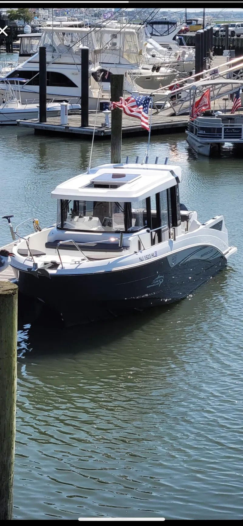 Slide: The Image of 2020 Beneteau Barracuda 8 boat docked in a marina, featuring sleek design and modern amenities. - 11