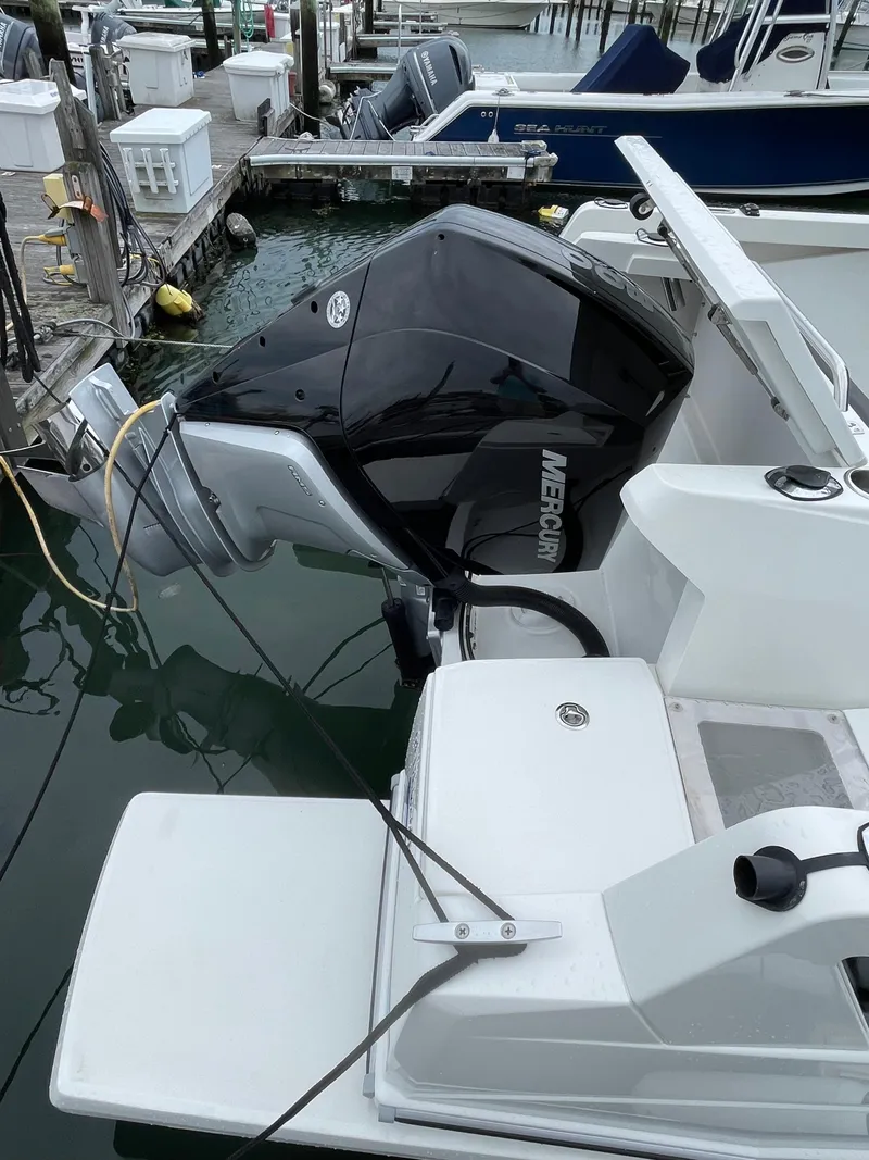 Slide: The Image of 2020 Beneteau BARRACUDA 8 with Mercury outboard engine docked at marina. - 16