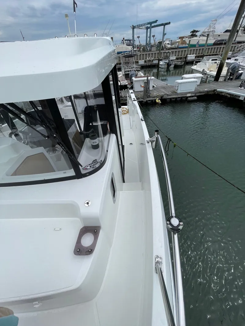 Slide: The Image of 2020 Beneteau BARRACUDA 8 docked at marina, side view. - 25