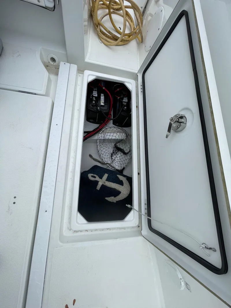 Slide: The Image of Open storage compartment on 2020 Beneteau Barracuda 8 with anchor and rope inside. - 26