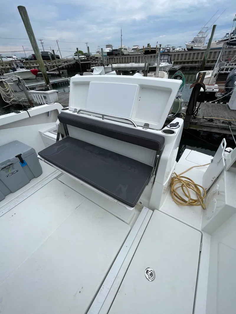 Slide: The Image of 2020 Beneteau Barracuda 8 boat with foldable seating at a marina. - 28