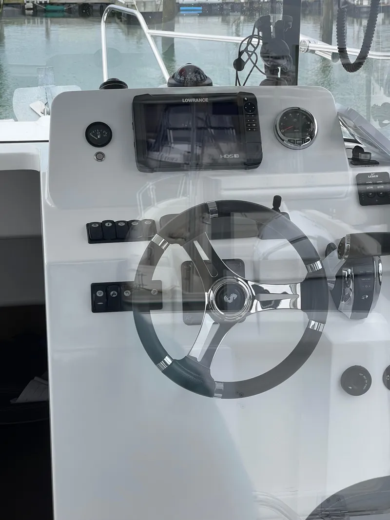 Slide: The Image of Steering console of 2020 Beneteau BARRACUDA 8 with navigation equipment. - 31