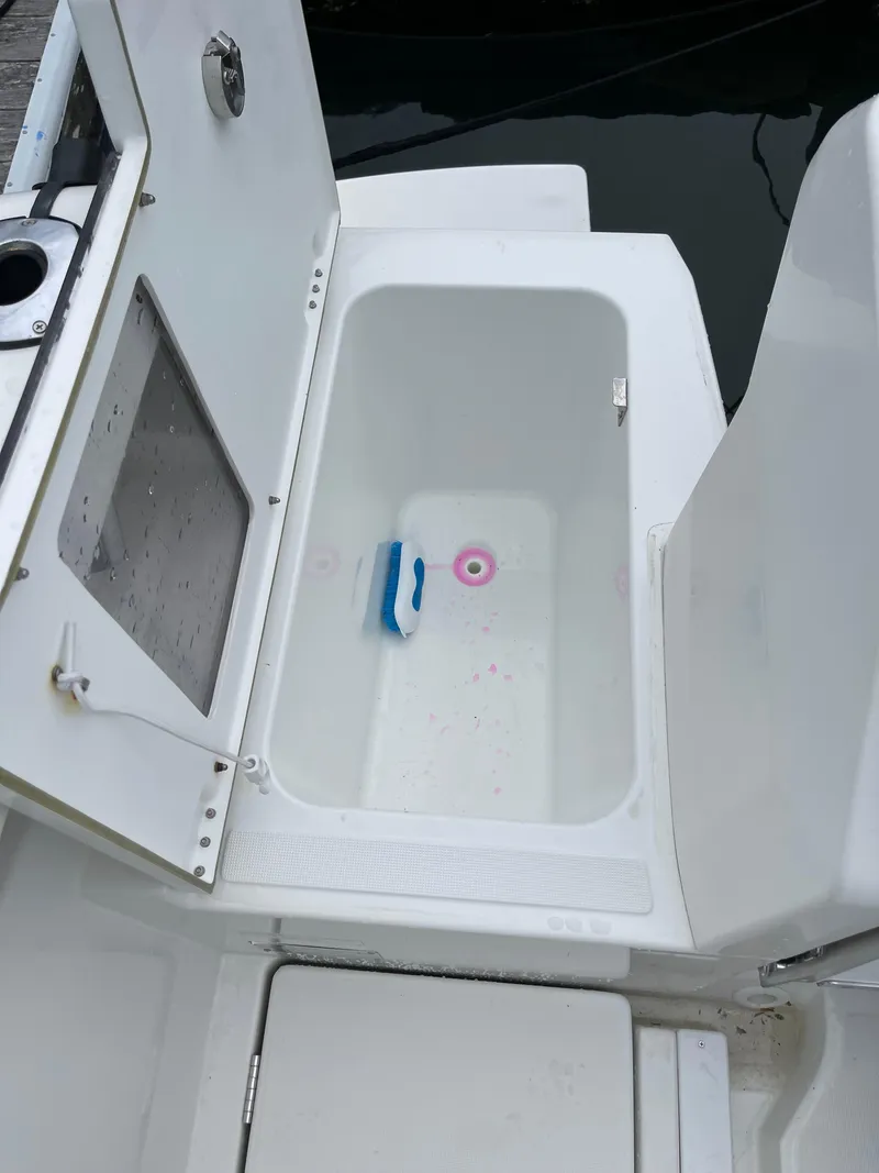 Slide: The Image of Open storage compartment on 2020 Beneteau Barracuda 8 boat, featuring a clean interior. - 34
