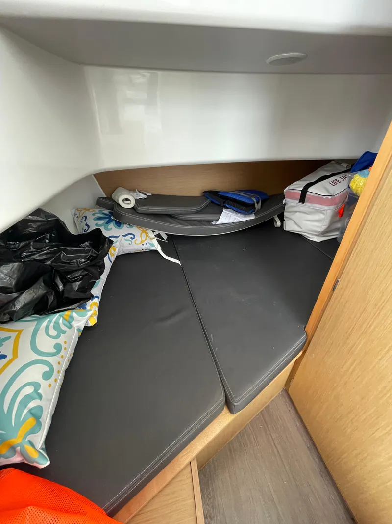 Slide: The Image of Interior cabin of 2020 Beneteau Barracuda 8 with cushions and storage items. - 43