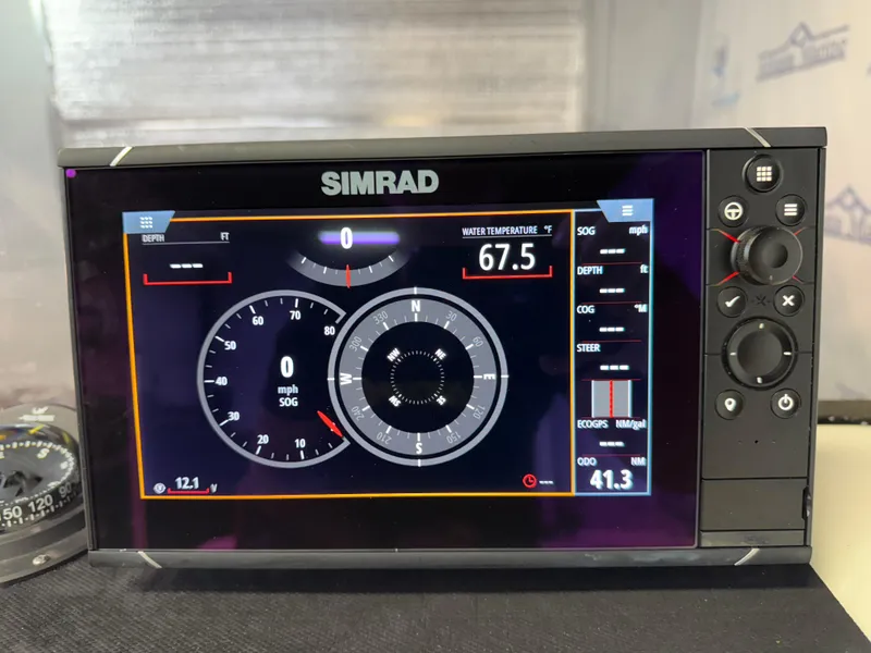 Slide: The Image of Simrad display on 2020 Mako 21 LTS boat showing navigation and water temperature. - 18