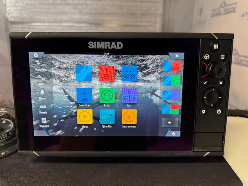 Slide: The Image of Simrad display on 2020 Mako 21 LTS boat, showing navigation and sonar options. - 19