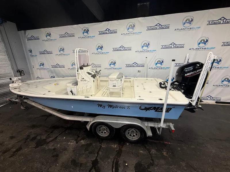 Slide: The Image of 2020 Mako 21 LTS boat with Guide Package on trailer, displayed indoors. - 3