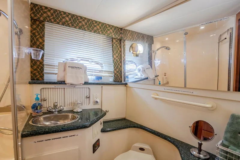 Slide: The Image of Luxurious interior of 2000 Carver 356 Aft Cabin Motor Yacht with cozy seating and modern amenities. - 7