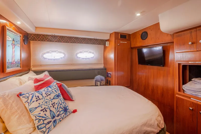 Slide: The Image of Interior of 2000 Carver 356 Aft Cabin Motor Yacht with cozy bedroom and bathroom. - 10