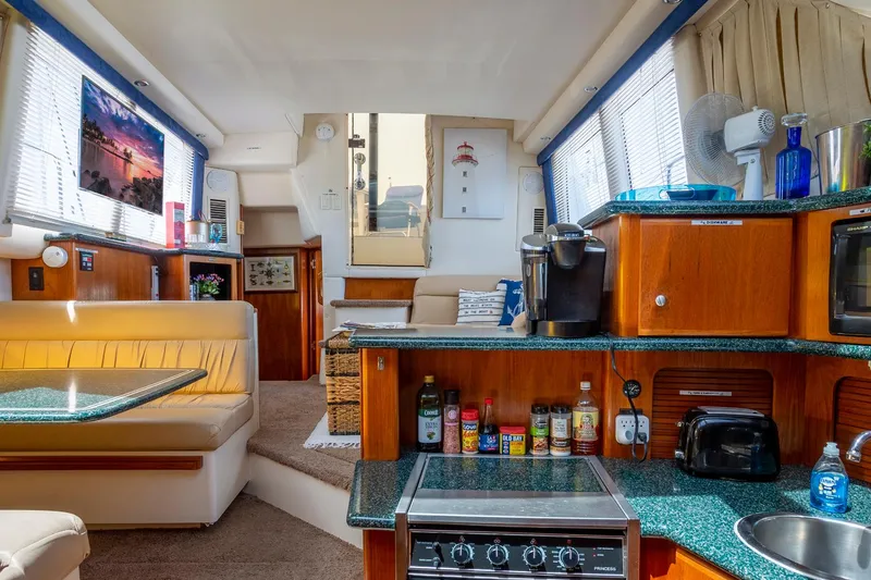 Slide: The Image of Cozy cabin interior of 2000 Carver 356 Aft Cabin Motor Yacht with nautical decor. - 13