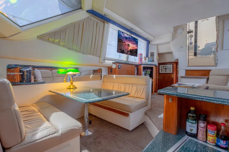 Slide: The Image of Interior of 2000 Carver 356 Aft Cabin Motor Yacht, featuring bedroom and bathroom. - 14
