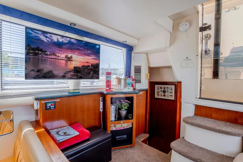 Slide: The Image of Interior of 2000 Carver 356 Aft Cabin Motor Yacht with cozy seating and elegant decor. - 16