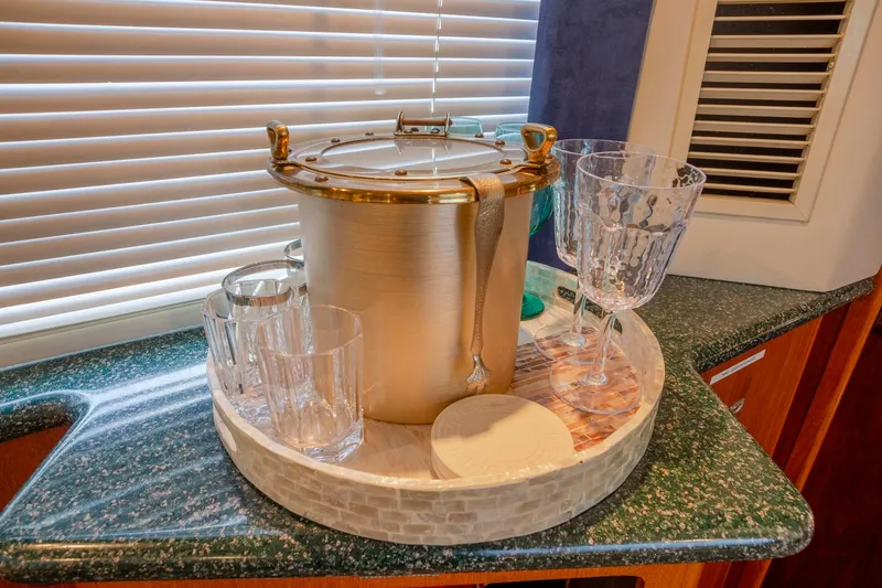 Slide: The Image of Dining area in 2000 Carver 356 Aft Cabin Motor Yacht with elegant table setting. - 20