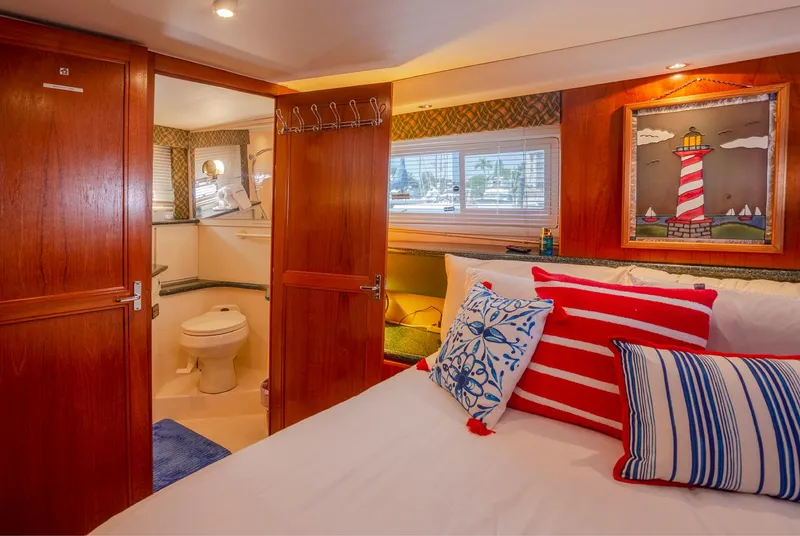Slide: The Image of Luxurious bedroom in 2000 Carver 356 Aft Cabin Motor Yacht with nautical decor. - 8