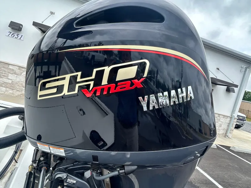 Slide: The Image of Yamaha SHO VMAX outboard motor on Avid 22 Recon, 2025 model, in a parking lot. - 8