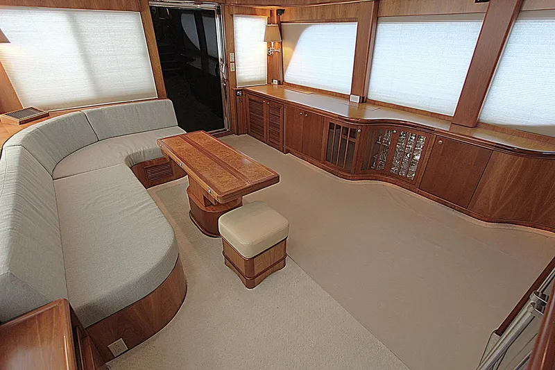Slide: The Image of Luxurious interior of a 2001 Symbol 62 Pilothouse yacht with elegant wood finishes. - 11