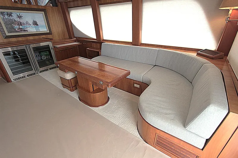 Slide: The Image of Luxurious 2001 Symbol 62 Pilothouse interior with elegant wood finishes and plush seating. - 12