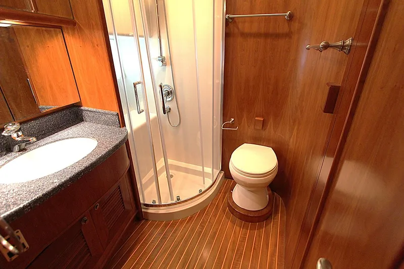Slide: The Image of Luxurious bathroom in 2001 Symbol 62 Pilothouse yacht with shower and wooden finishes. - 20
