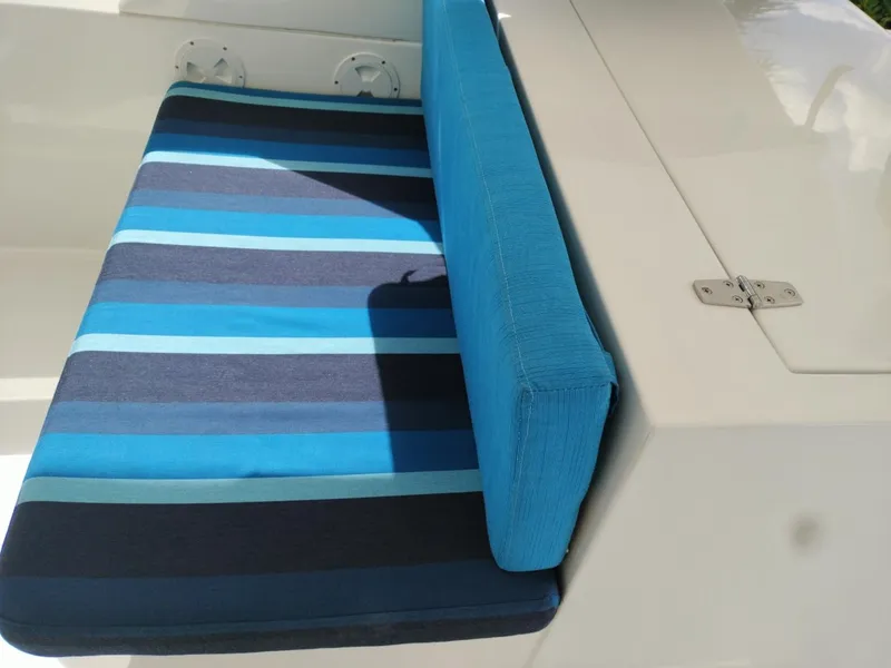 Slide: The Image of Blue striped seating on a 2001 Symbol 62 Pilothouse boat. - 24