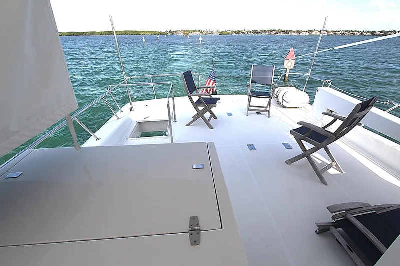 Slide: The Image of Spacious deck of 2001 Symbol 62 Pilothouse yacht with chairs overlooking the water. - 25