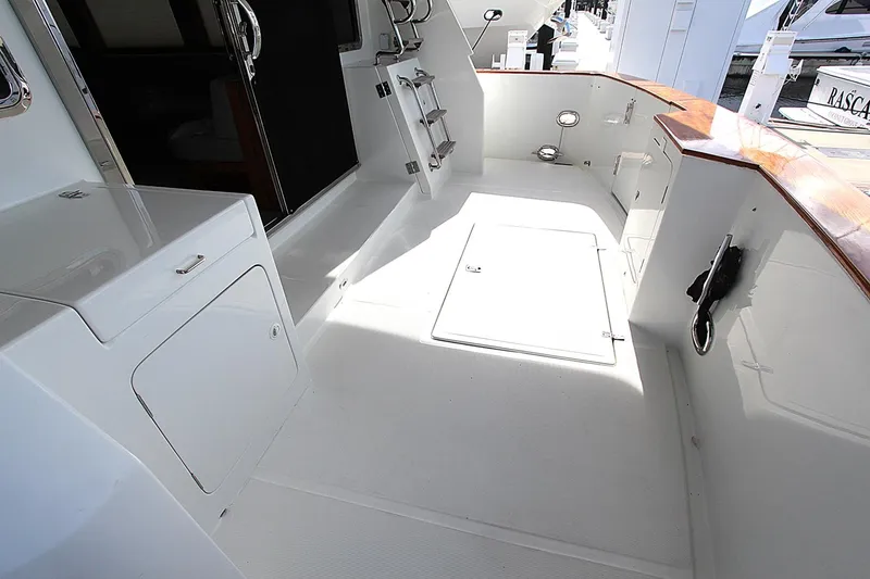 Slide: The Image of Spacious deck of 2001 Symbol 62 Pilothouse yacht with white finish and wood accents. - 4