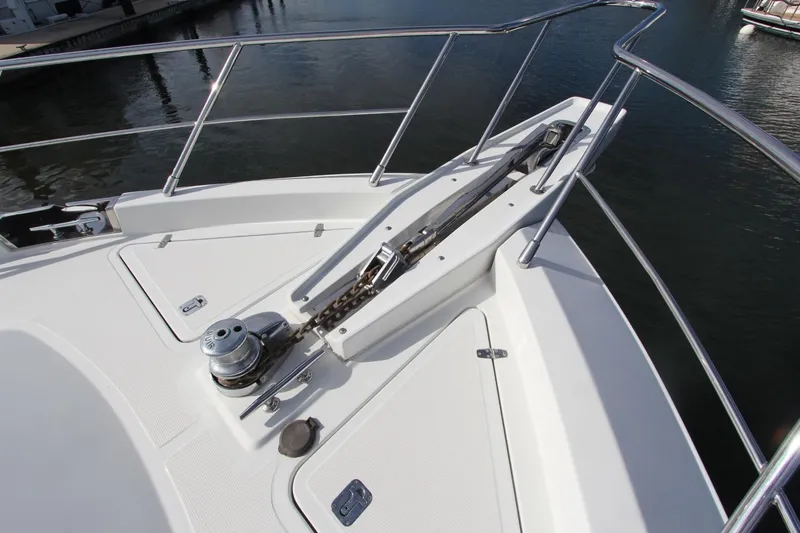 Slide: The Image of Bow of 2001 Symbol 62 Pilothouse yacht with anchor chain and railing. - 8