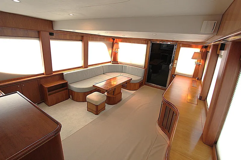 Slide: The Image of Luxurious interior of a 2001 Symbol 62 Pilothouse yacht with elegant wood finishes. - 9
