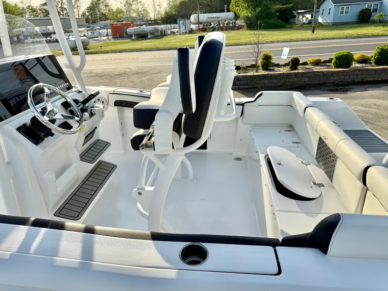 Slide: The Image of 2025 Tidewater 210 LXF boat interior with seating and steering console. - 10