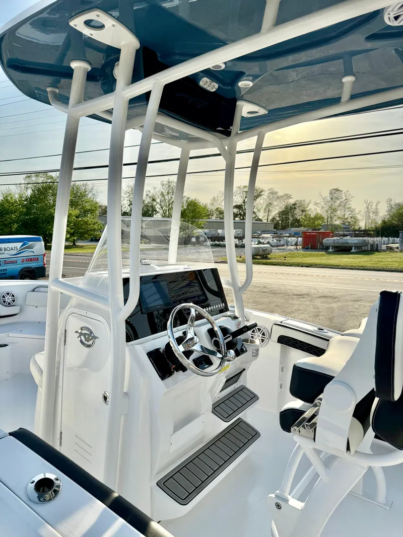 Slide: The Image of 2025 Tidewater 210 LXF boat interior with modern helm and seating. - 12