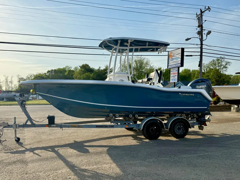 Slide: The Image of 2025 Tidewater 210 LXF boat on trailer, parked outdoors, side view. - 5