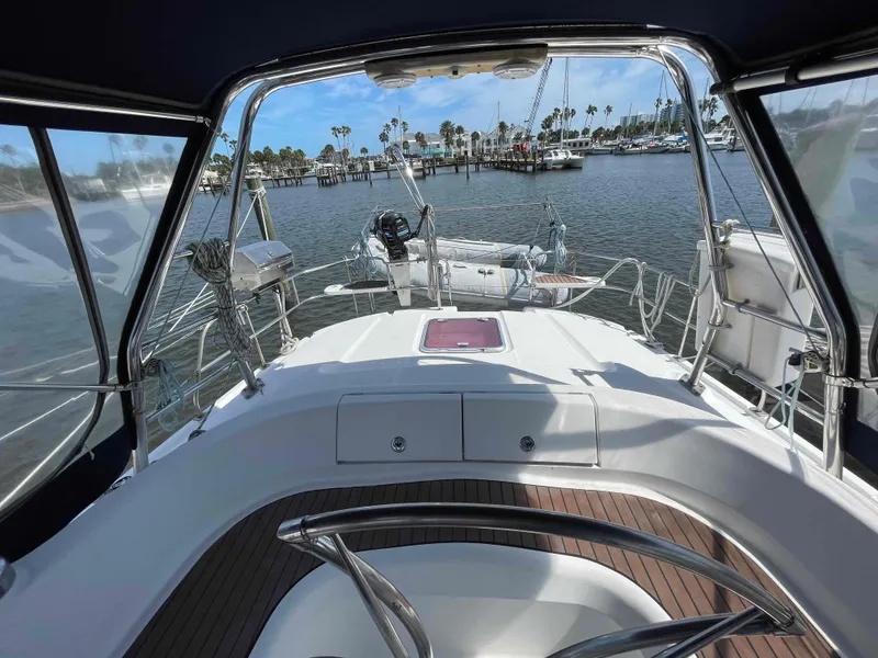 Slide: The Image of Hunter 45 Center Cockpit sailboat, 2006 model, docked at marina with scenic water view. - 10