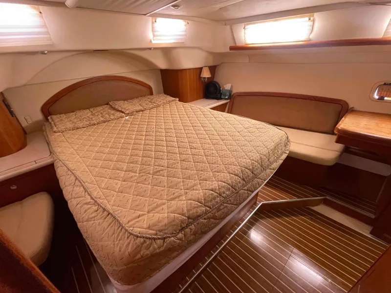 Slide: The Image of Luxurious cabin interior of 2006 Hunter 45 Center Cockpit yacht with cozy bed and seating. - 18