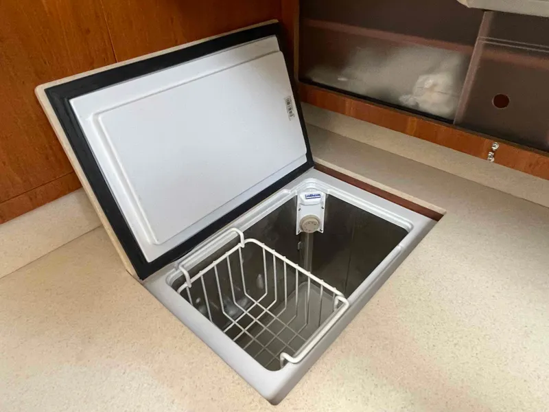 Slide: The Image of Open freezer compartment in 2006 Hunter 45 Center Cockpit yacht kitchen. - 27