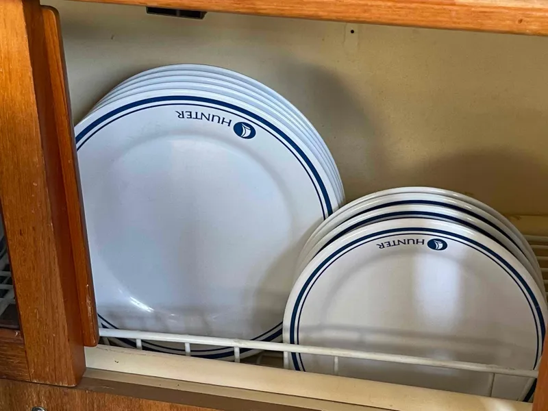 Slide: The Image of Plates with "Hunter" logo in a wooden cabinet, Hunter 45 Center Cockpit, 2006. - 29