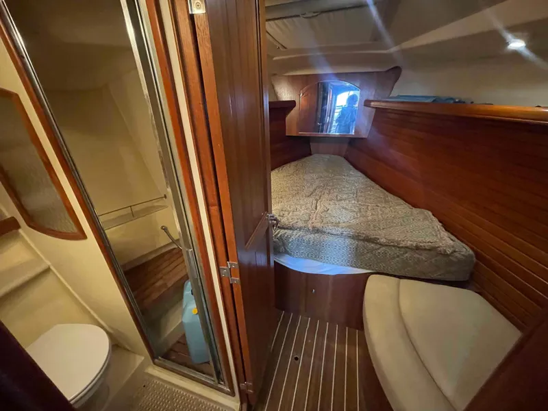 Slide: The Image of Interior of 2006 Hunter 45 Center Cockpit yacht with cozy cabin and bathroom. - 33