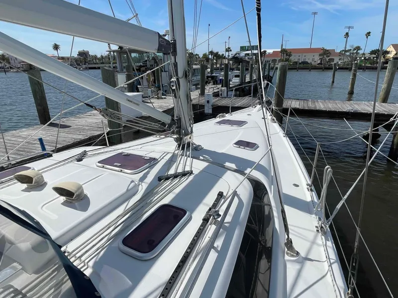 Slide: The Image of Sailboat docked at marina, 2006 Hunter 45 Center Cockpit, clear sky, calm water. - 43