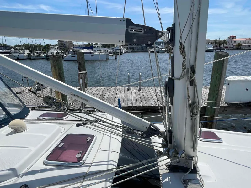 Slide: The Image of Hunter 45 Center Cockpit sailboat, 2006 model, docked at marina with visible rigging and deck. - 44