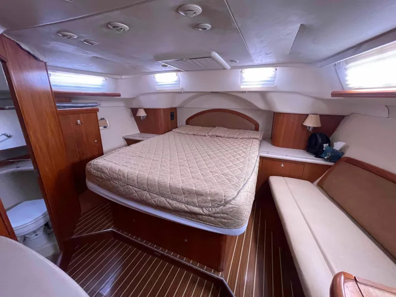 Slide: The Image of Luxurious cabin interior of 2006 Hunter 45 Center Cockpit yacht with bed and seating. - 8