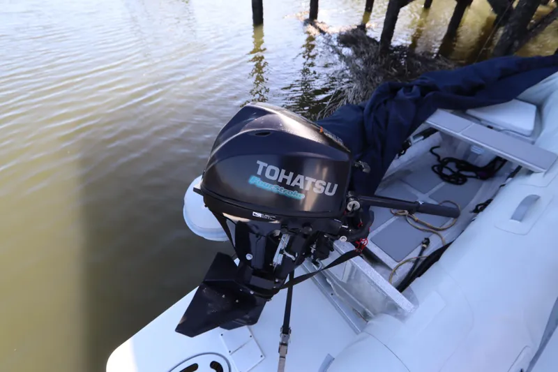 Slide: The Image of 2015 Cruisers Cantius boat with Tohatsu outboard motor on calm water. - 18
