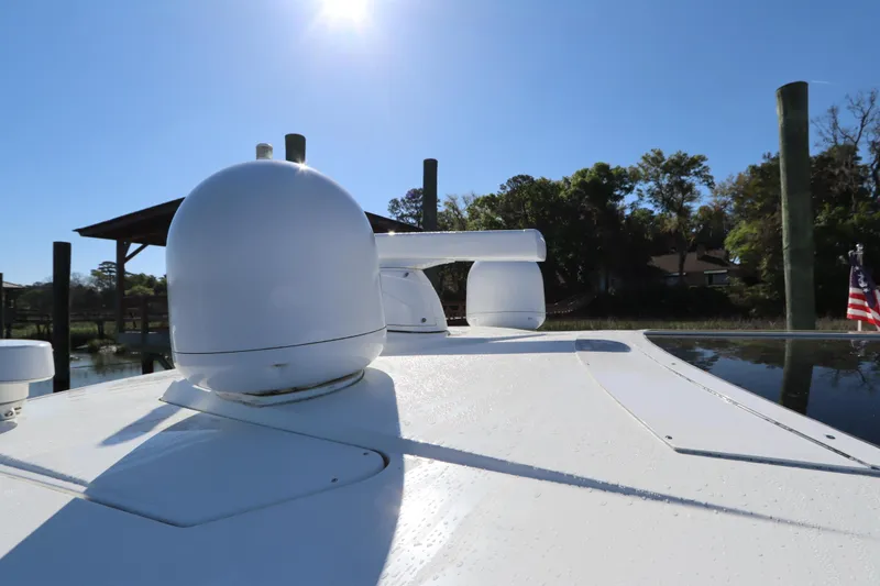 Slide: The Image of 2015 Cruisers Cantius yacht deck with radar equipment under clear blue sky. - 29