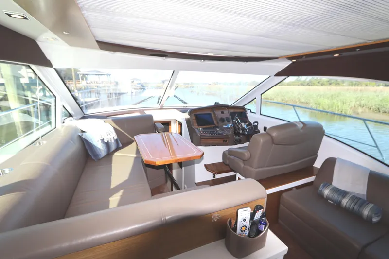 Slide: The Image of Luxurious 2015 Cruisers Cantius yacht interior with plush seating and modern helm. - 37